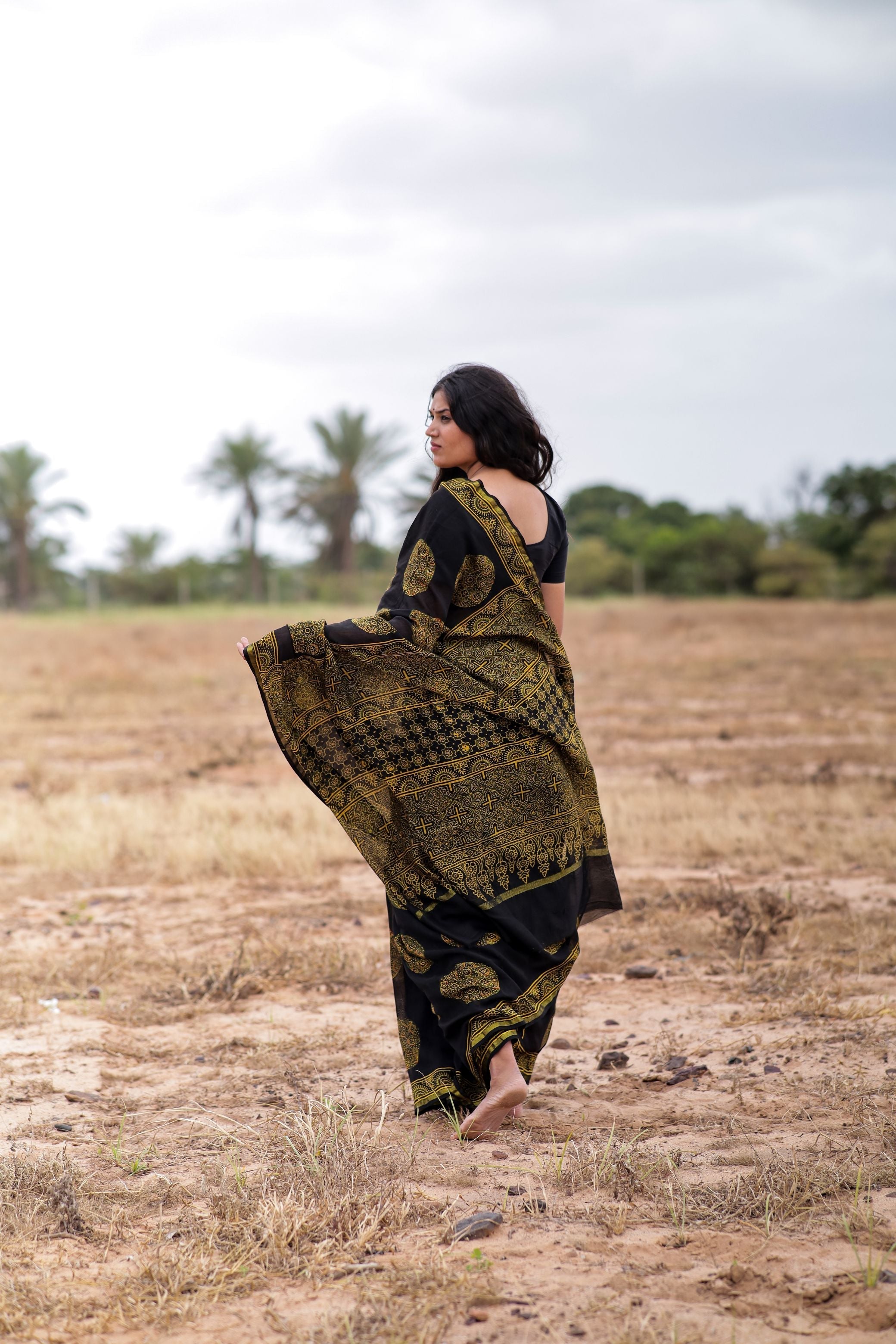 Jharokha -Black and green floral silk cotton Ajrakh handblockprinted saree