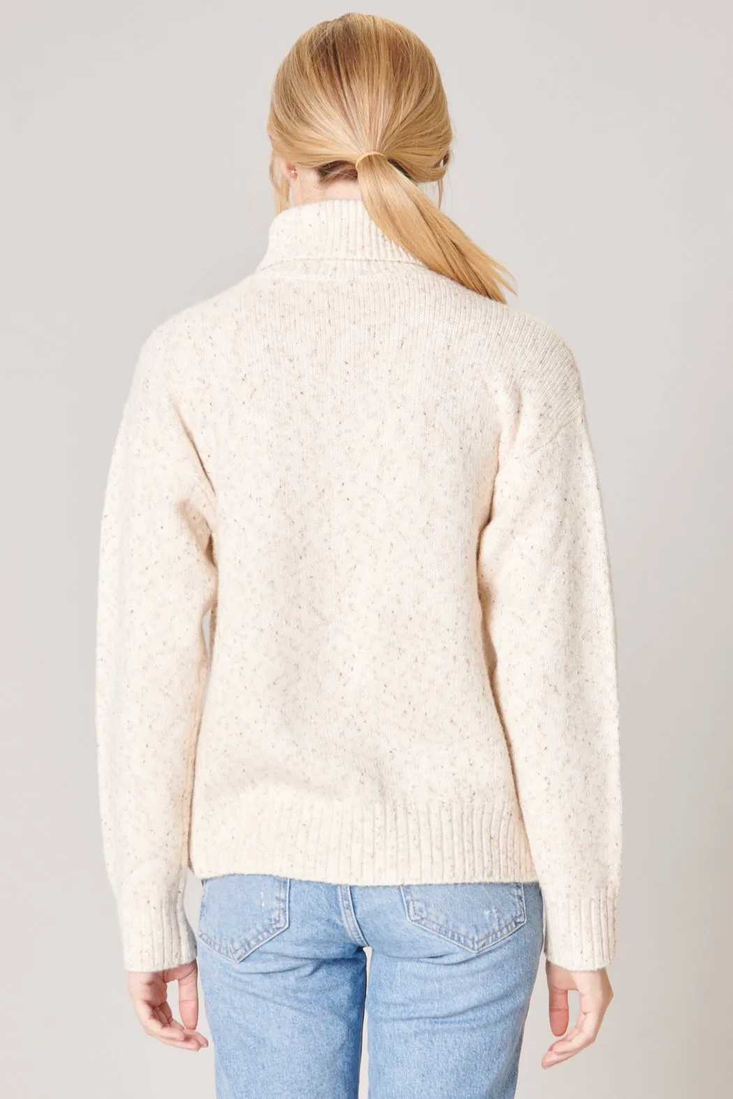 Wonderland Cable Knit Turtleneck Sweater